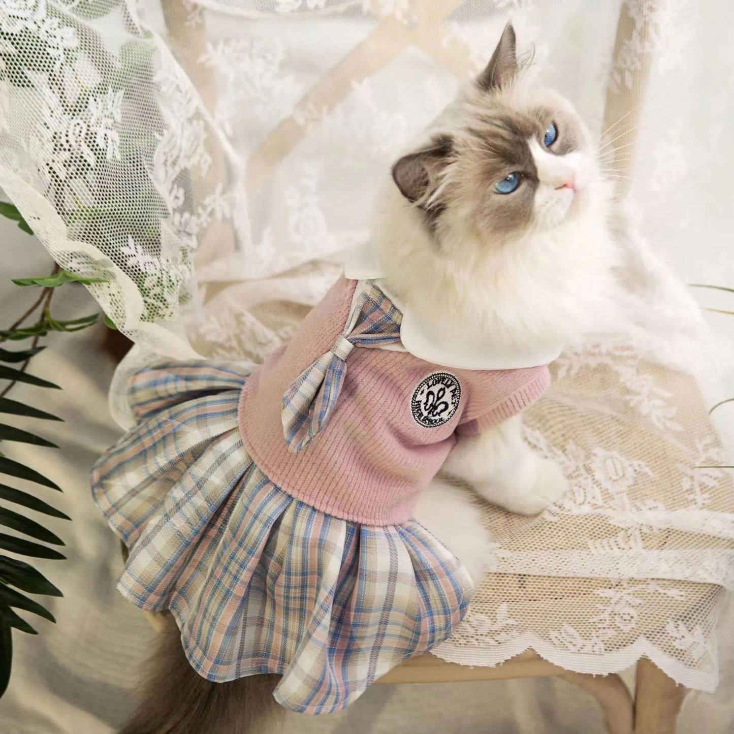 A pink, blue, or green tartan skirt for dogs and cats, shown in a princess style.