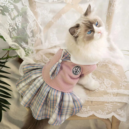 A pink, blue, or green tartan skirt for dogs and cats, shown in a princess style.