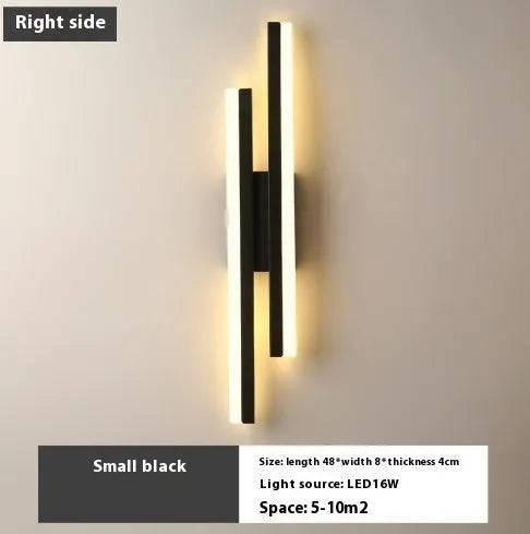 Scandinavian minimalist LED wall light with acrylic shade and adjustable arm in black or gold finish.