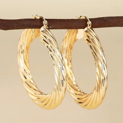 Geometric drop-shaped ear clip earrings with electroplated finish in various colours
