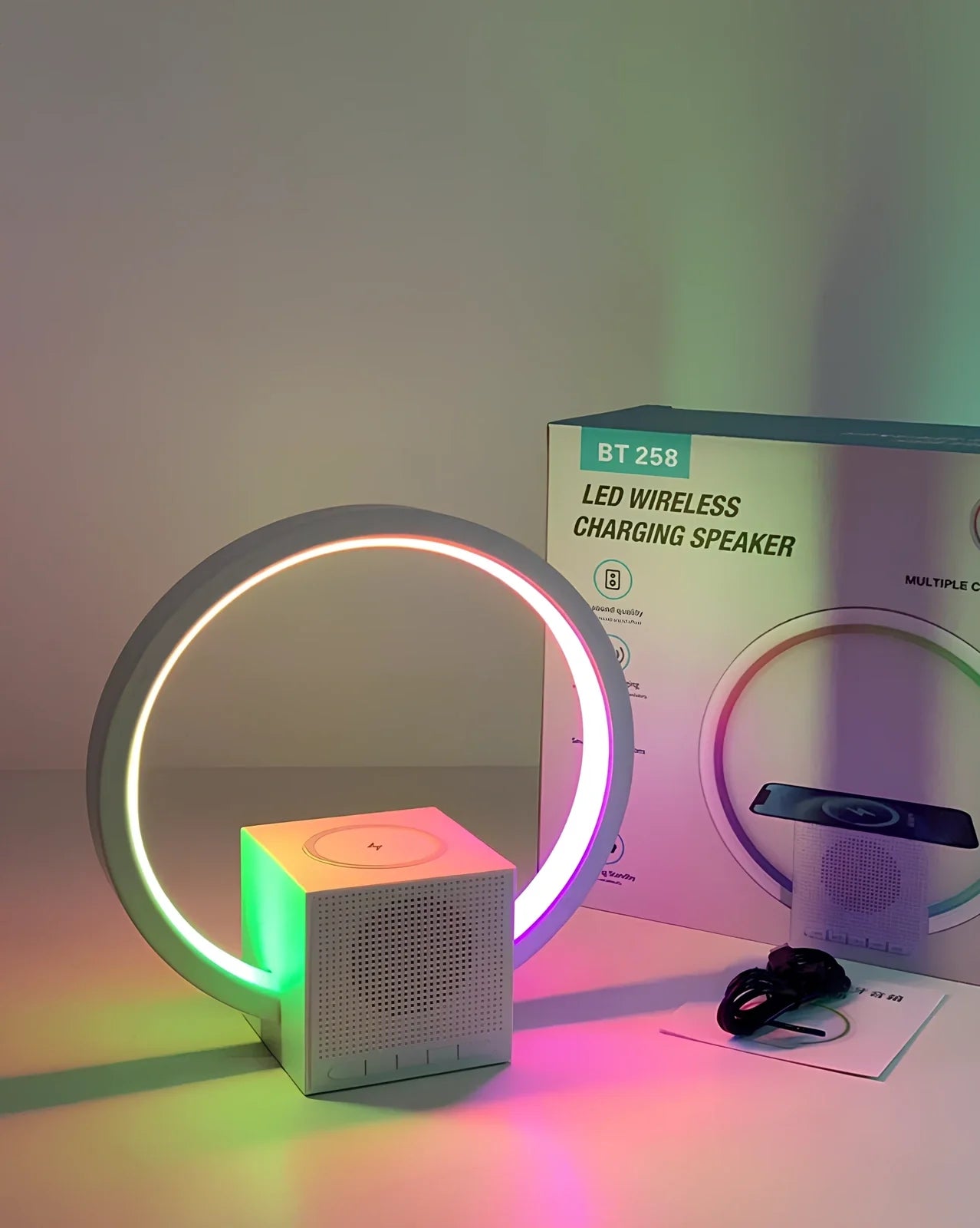 White Smart Ambience Light Bluetooth Speaker Wireless Charger unit showing wireless charging area, speaker components, and ambient lighting