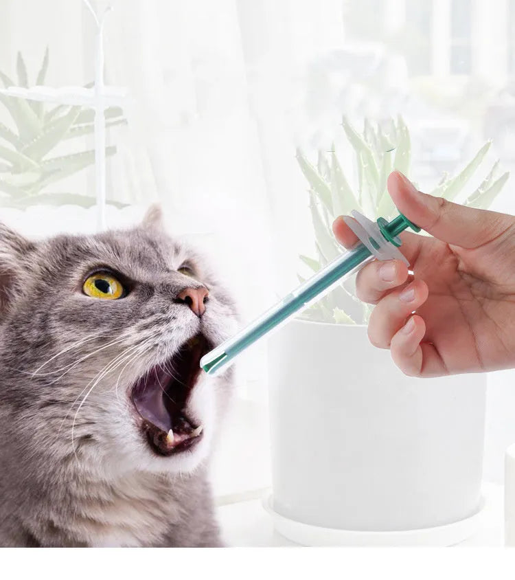 Two silicone pet pill shooters with soft tips for cat and dog medication.