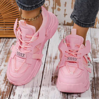Women's platform sneakers in animal print with breathable mesh upper and front lace-up design.