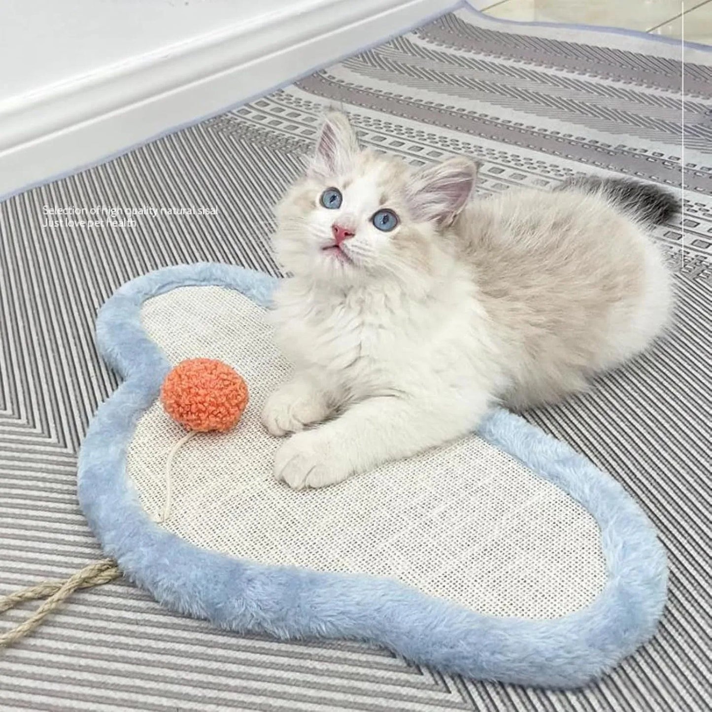 White wall-mounted cat scratching mat with sleeping cat cartoon design, made from natural sisal.