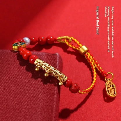 Women's red cinnabar hand-woven rope bracelet with geometric design and bell charm