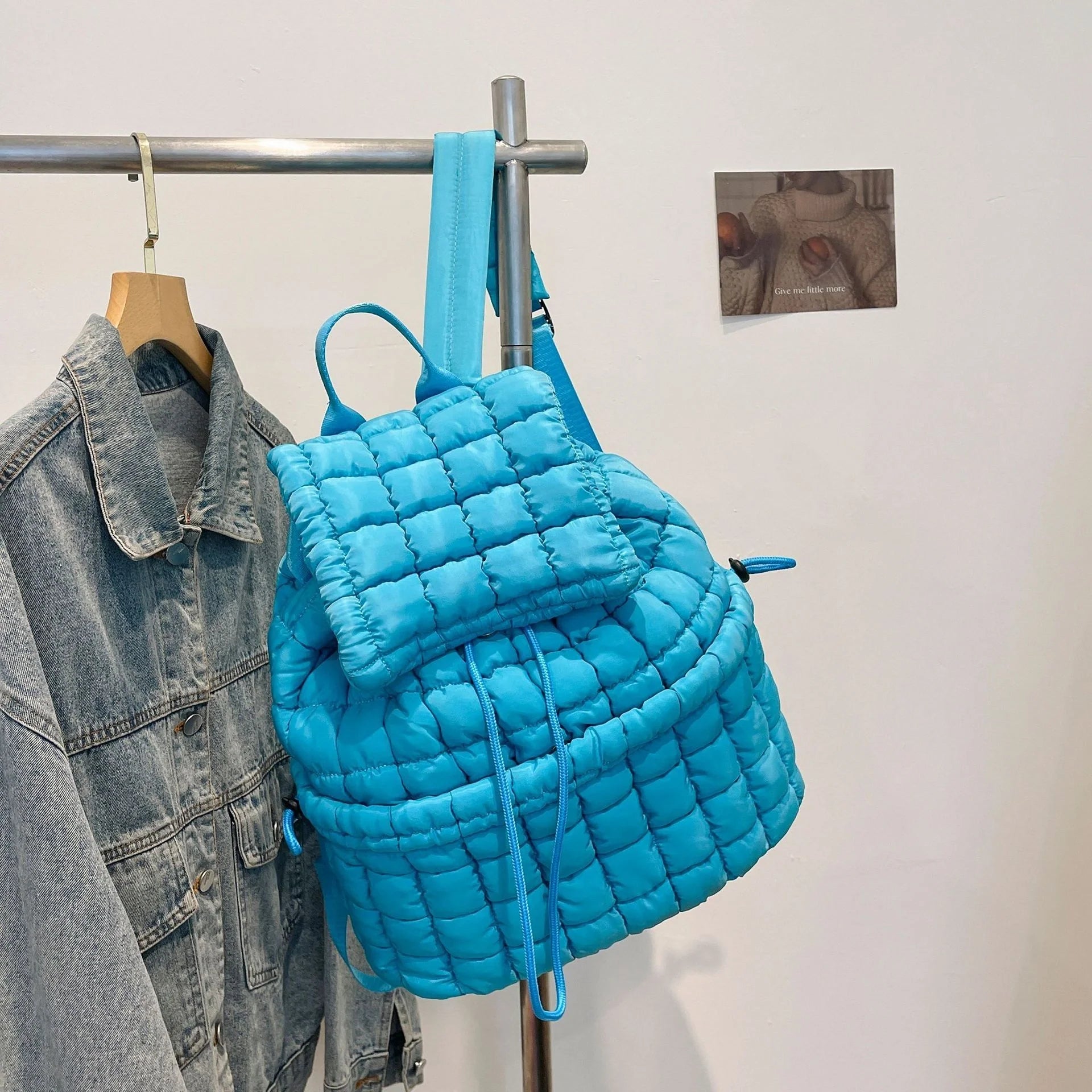 Soft, quilted puffer backpack in a variety of colors, perfect for autumn and winter wear