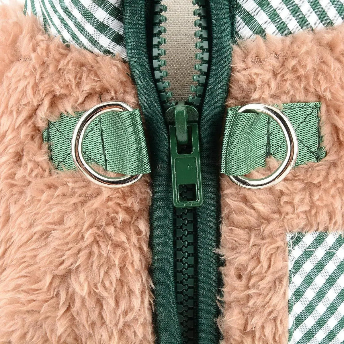 Green plush fleece dog jumpsuit coat with a back zipper and D-rings on a small dog.