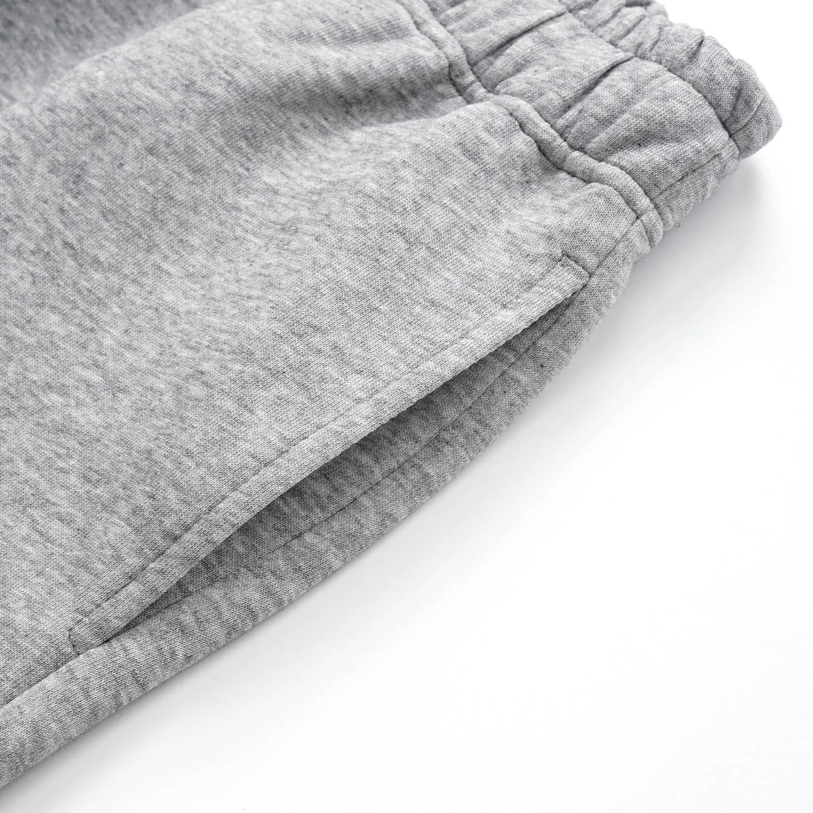 Men's straight-leg grey cotton casual trousers with an elasticated waistband laid flat.
