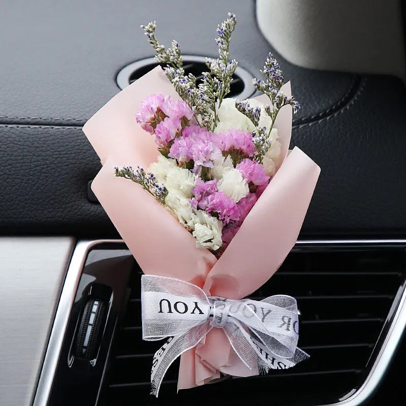Mini dried flower bouquet mounted in car air vent for decorative aromatherapy