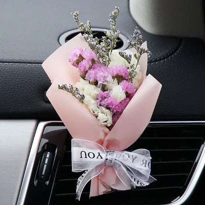 Mini dried flower bouquet mounted in car air vent for decorative aromatherapy