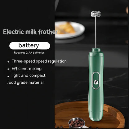 Battery-powered handheld milk frother in retro green, black, or white with stainless steel whisk