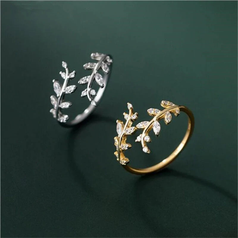 Women's fashion branch ring with leaf design in silver and gold finishes