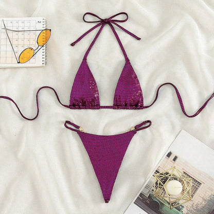 Solid blue women's T-back bikini set laid flat, showing bra and briefs.