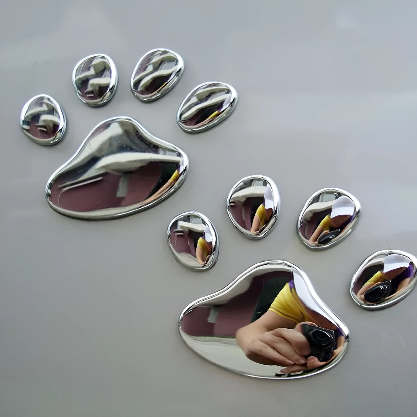 Pair of hand-shaped brush dog footprints PVC car sticker in black, gold, red, or silver colour.