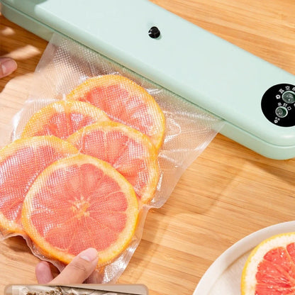Green compact vacuum sealing machine, 32x7.5x5cm size, 110W power for food preservation with -50kPa pressure