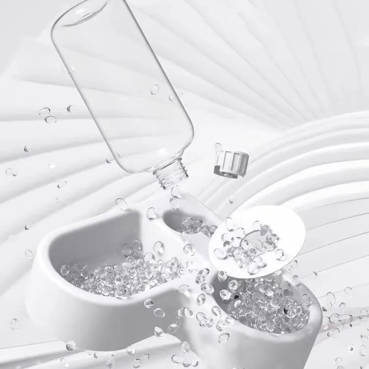 White plastic pet water fountain with pump for cats and dogs on a floor.