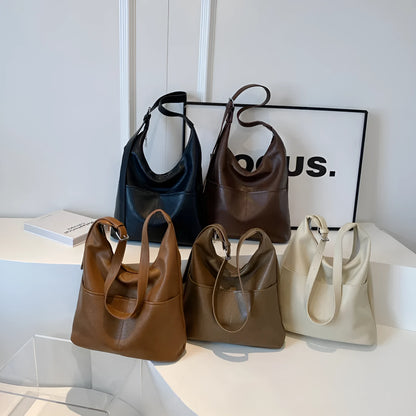Women's soft PVC bucket shoulder bag with single strap, open pocket, phone pocket, and matching wallet