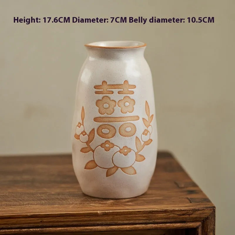 Hand-painted Chinese ceramic vase with carved detail on a desk, shown in Double Happiness colour design.