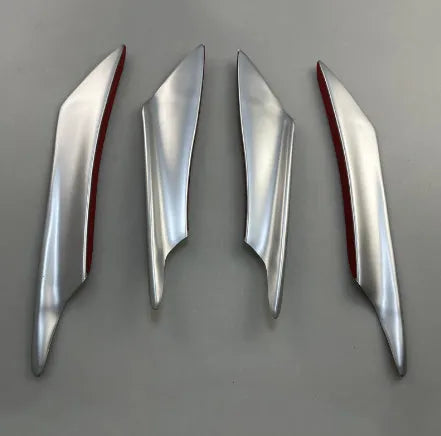 Set of four carbon fibre pattern ABS plastic bumper blades for car modification.
