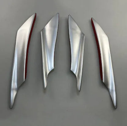 Set of four carbon fibre pattern ABS plastic bumper blades for car modification.