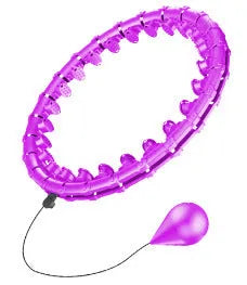 Pink massage soft ball with a detachable black belt, shown on a fitness mat.