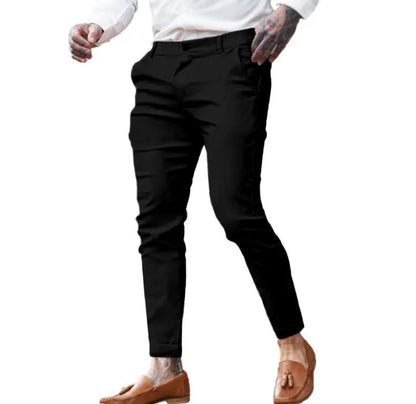 Men's slim fit elastic cotton pencil trousers in a solid colour on a hanger, showing the zip fly and mid waist design.