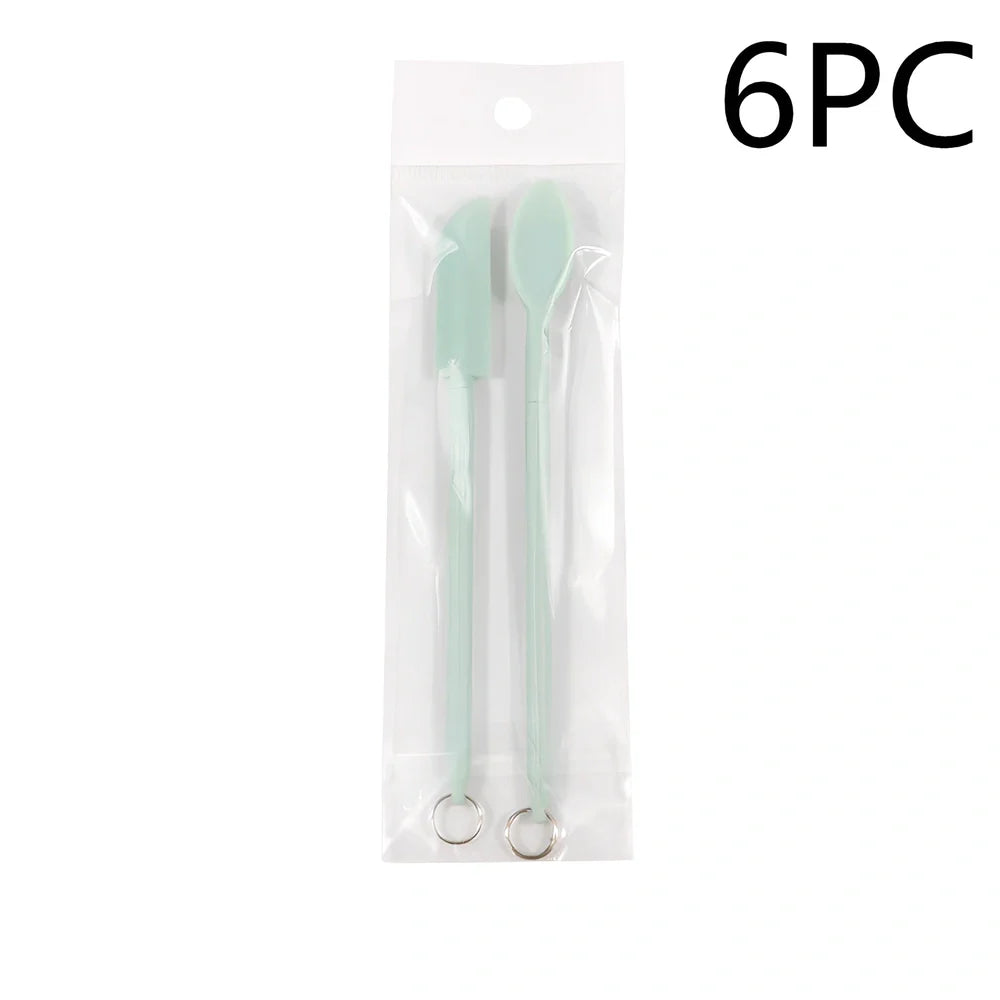 Retractable silicone cosmetic spatula extended to 15cm with scraper tool for product application