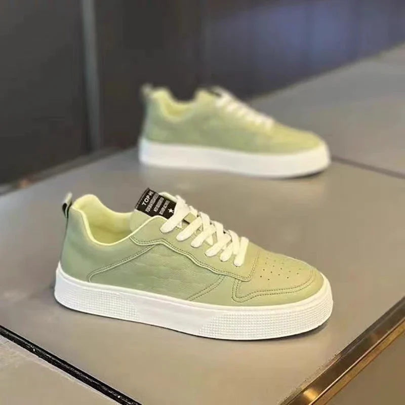 Stylish plaid lace-up sneakers with breathable mesh lining and durable rubber sole for casual comfort and versatile style.
