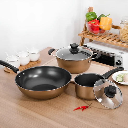 Cast iron three-piece cookware set showing a soup pot, milk pot, and wok with non-stick coating.