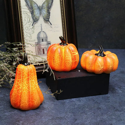 Set of three resin Halloween pumpkin lanterns with LED lights in long, medium, and short sizes.
