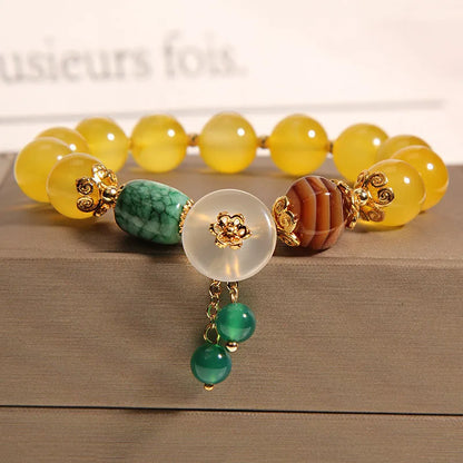 Women's yellow agate crystal bracelet on gold silk cord with Japanese style design