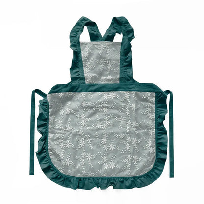 Minimalist kitchen apron with X-strap design in cotton linen fabric showing lace trim detail