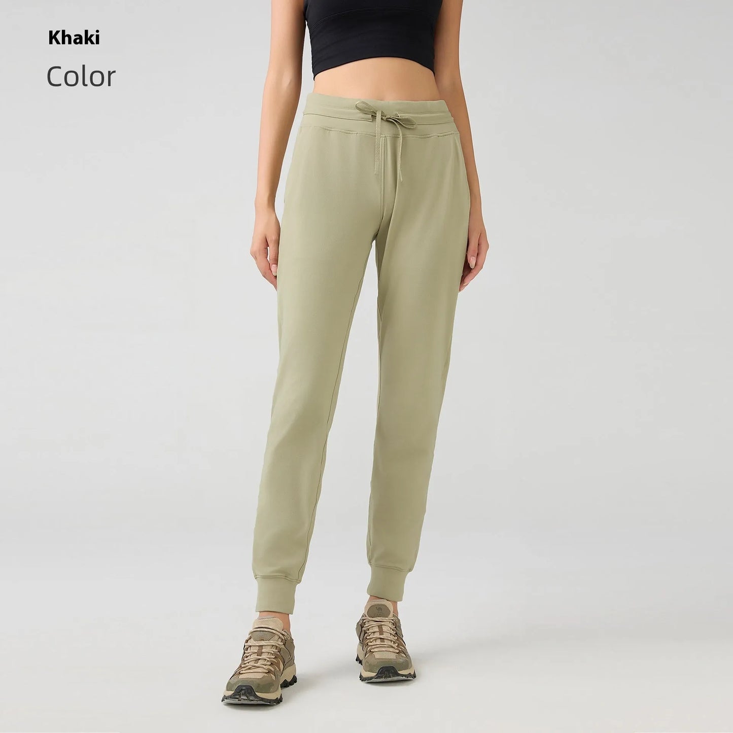 Women's high waist yoga pants with drawstring waistband in Belgian blue colour, showing stretch fabric during yoga pose