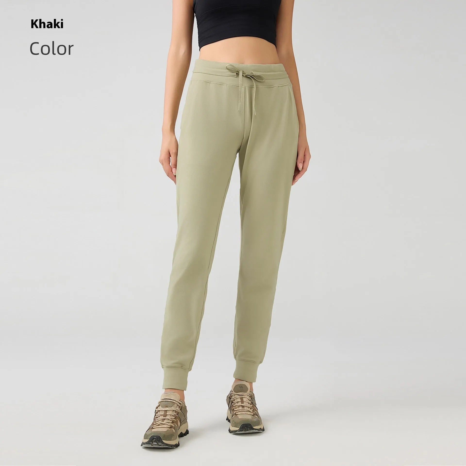 Women's high waist yoga pants with drawstring waistband in Belgian blue colour, showing stretch fabric during yoga pose