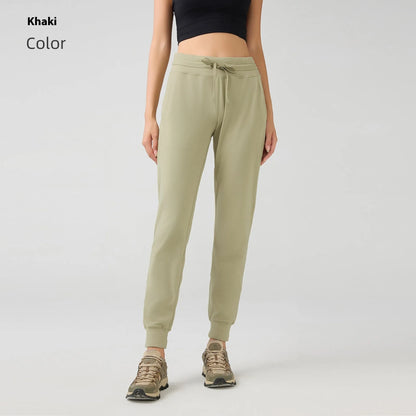 Women's high waist yoga pants with drawstring waistband in Belgian blue colour, showing stretch fabric during yoga pose