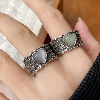 Retro wide-faced heart-shaped silver ring with adjustable opening in white or green colour