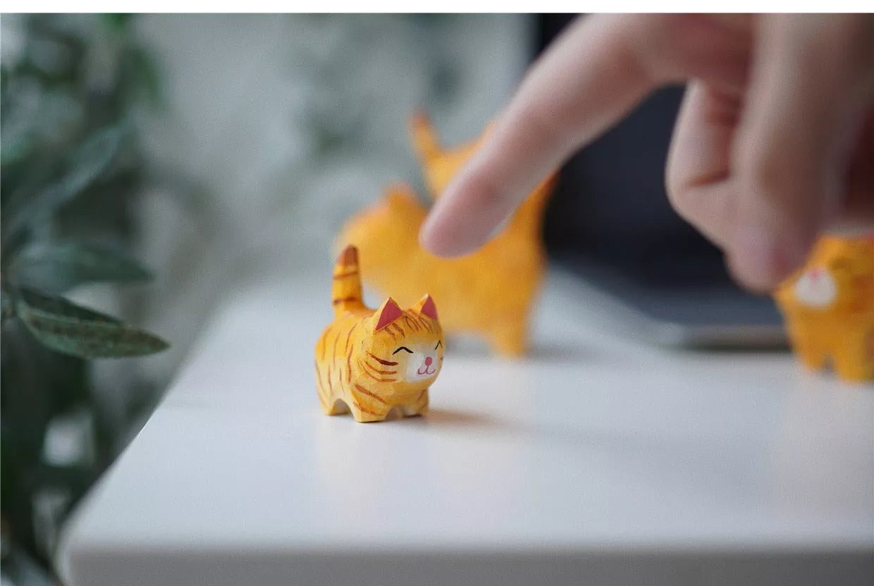 Handmade wooden cat trinkets in gray and orange, perfect for decor or gifts