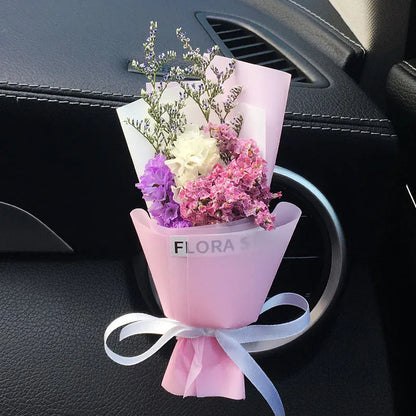 Mini dried flower bouquet mounted in car air vent for decorative aromatherapy