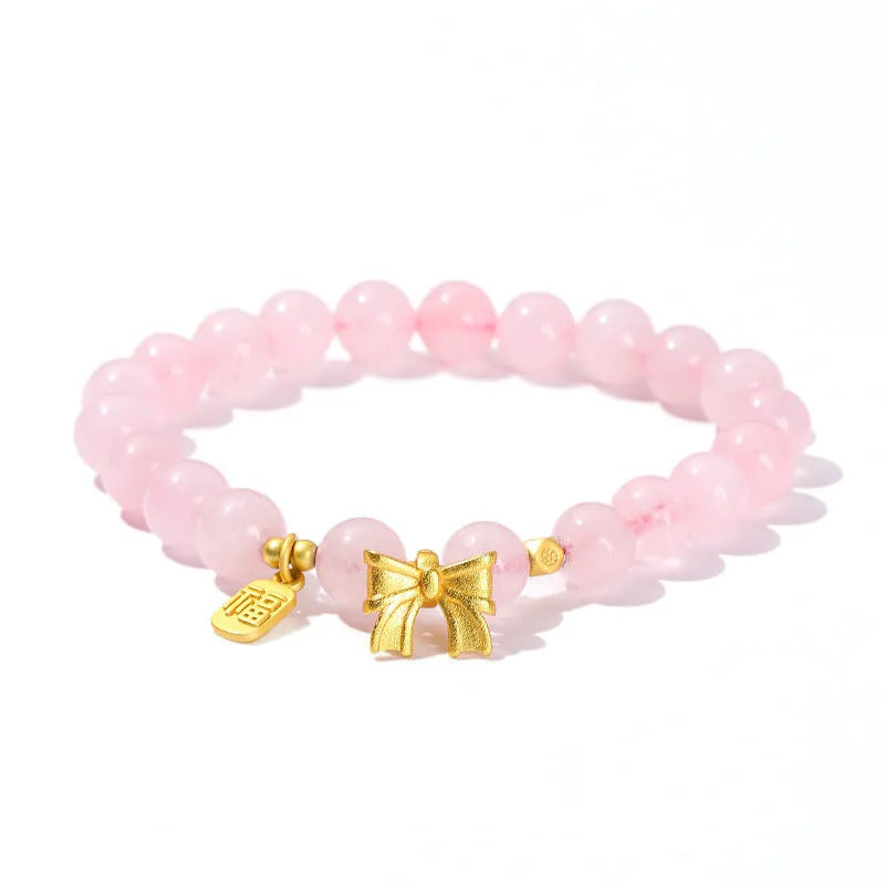 Close-up of a manually crafted crystal agate bracelet with shaped animal and fruit beads.