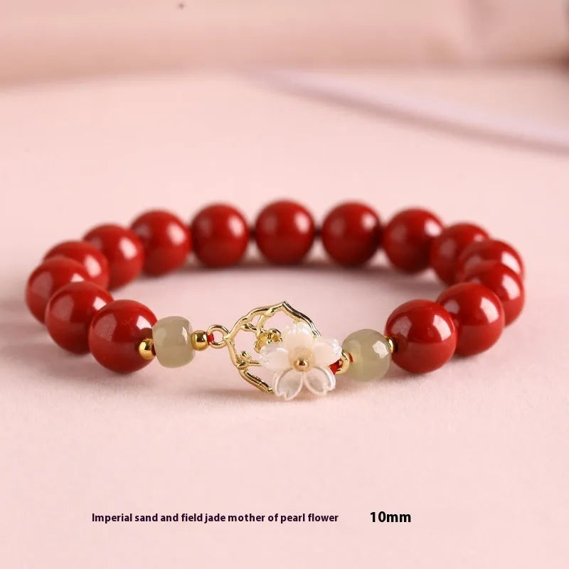 Handcrafted Hetian Jade New Chinese style bracelet in cinnabar with white butterfly, lotus and bells of Ireland motifs