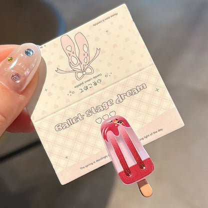 A resin hair barrette with a cartoon ice cream charm on a side-clip, shown in a pink colour variant.