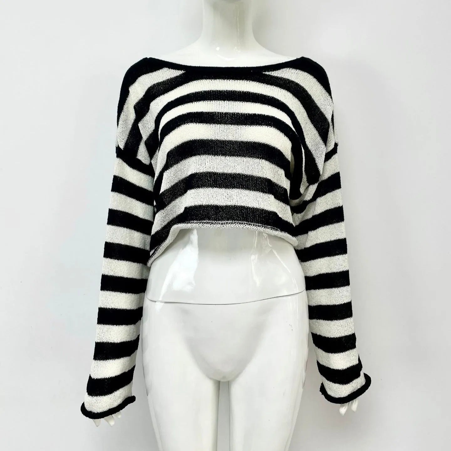 Reversible black and white striped cropped sweater shown worn both front and back.