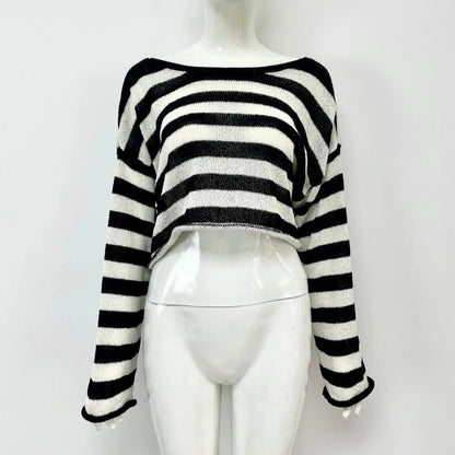 Reversible black and white striped cropped sweater shown worn both front and back.