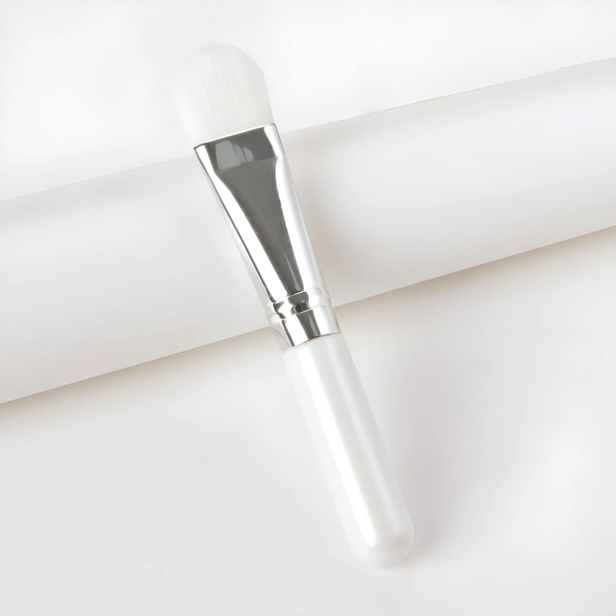 Wooden handle facial treatment brush, 12cm total length, 2cm artificial fibre bristles, black or wood colour.