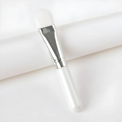 Wooden handle facial treatment brush, 12cm total length, 2cm artificial fibre bristles, black or wood colour.