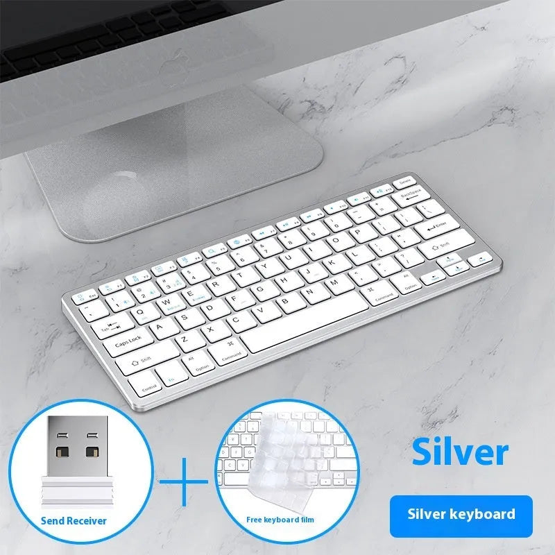 Black ultra-thin wireless keyboard and mouse combo with USB receiver and keyboard cover on a desk.