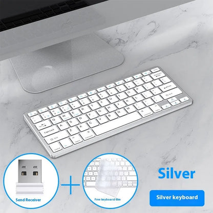 Black ultra-thin wireless keyboard and mouse combo with USB receiver and keyboard cover on a desk.