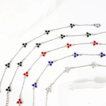 Women's stainless steel bracelet with three triangle-shaped charms in different coloured stone settings