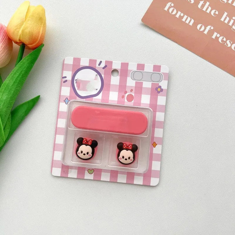Colourful cartoon magnetic USB-C data cable fixer for desktop hubs on a desk.