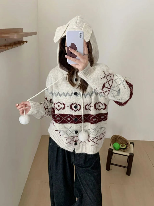 Women's loose-fit brocade sweater coat with geometric pattern in milky white colour, showing long sleeves and regular sleeve cut